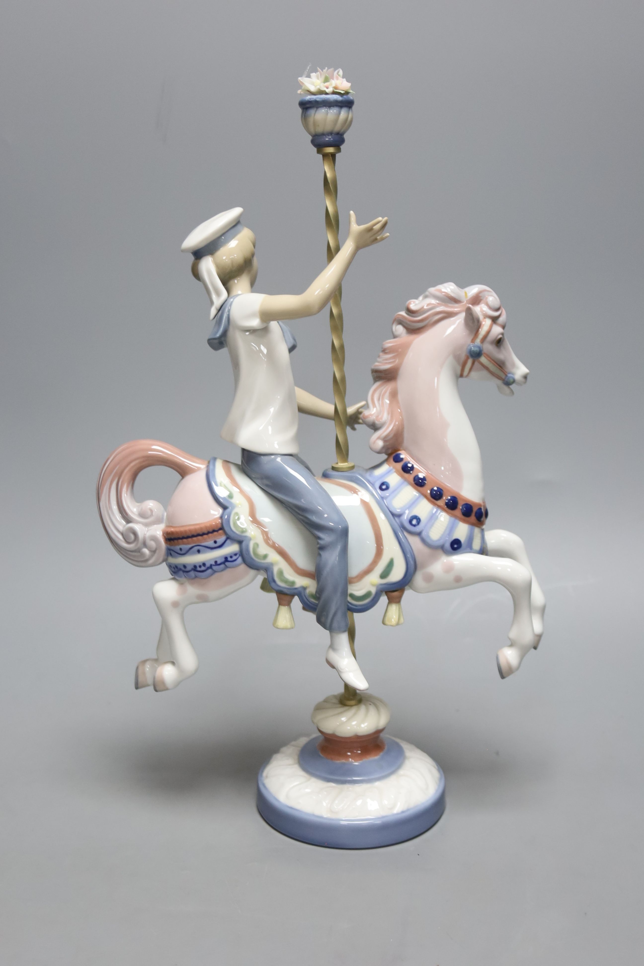 A Lladro figure, Boy on a Carousel Horse, height 39cm H 39cm